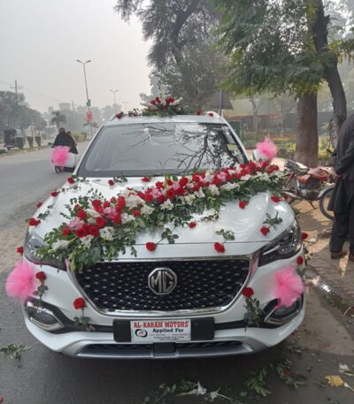 Wedding car décor with ribbons and floral garlands