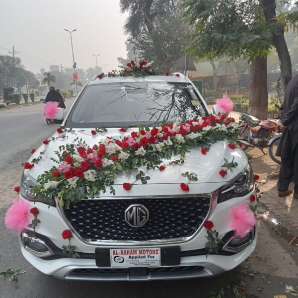 Wedding car décor with ribbons and floral garlands