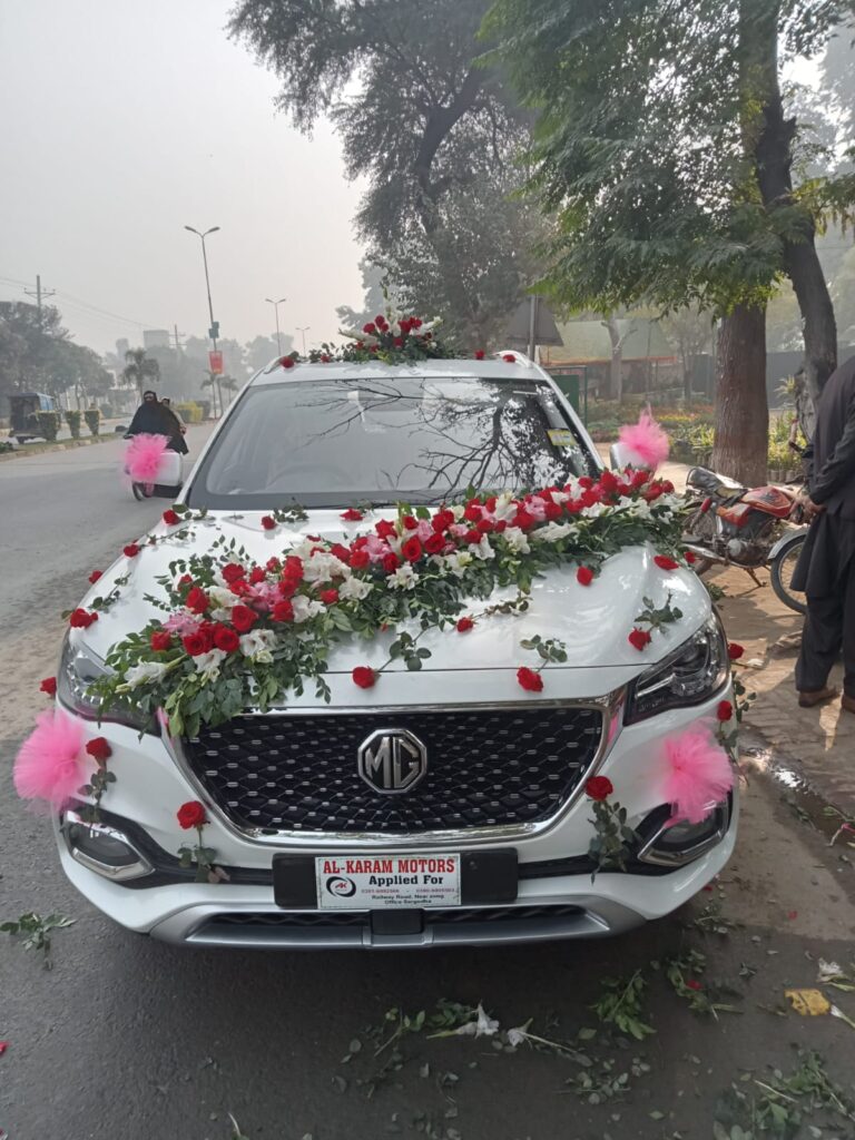 Wedding car décor with ribbons and floral garlands