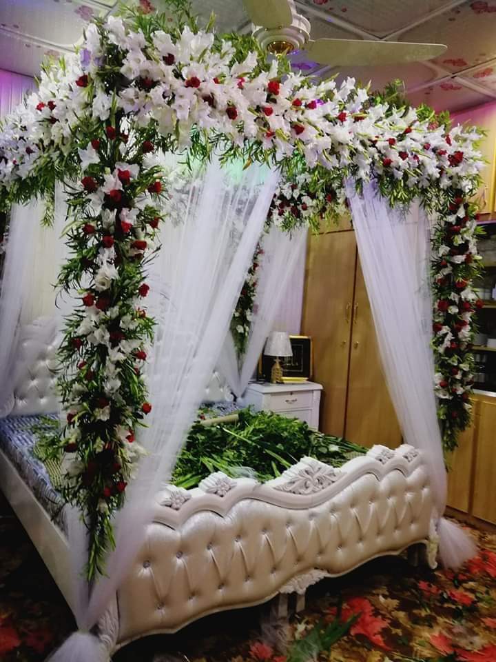 Anniversary room decoration with LED lights and flowers