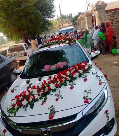 Bridal car decoration with fresh roses in Sargodha