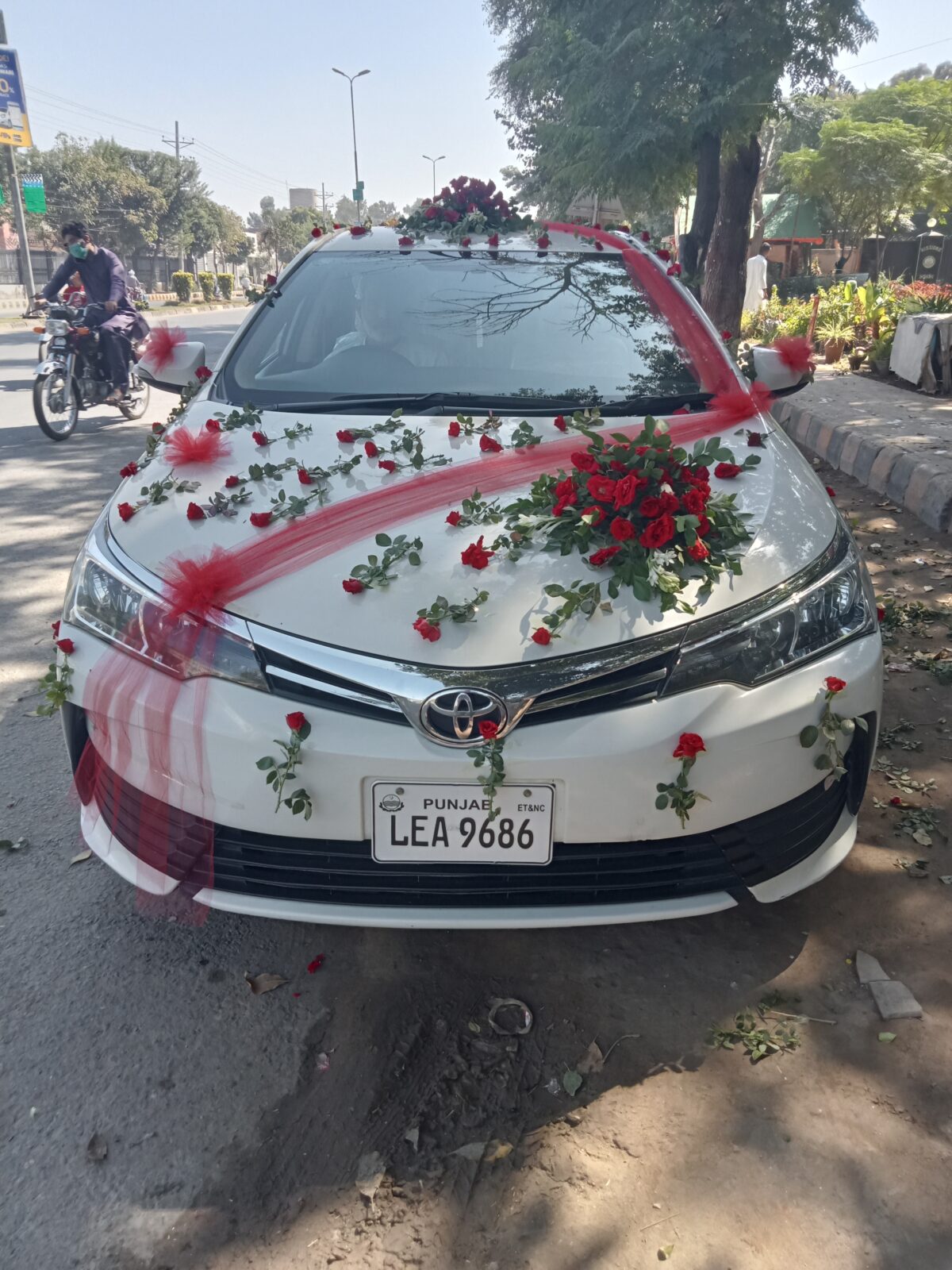 Premium wedding car decoration with orchids and roses