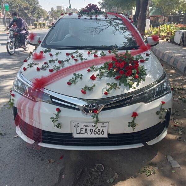 Premium wedding car decoration with orchids and roses