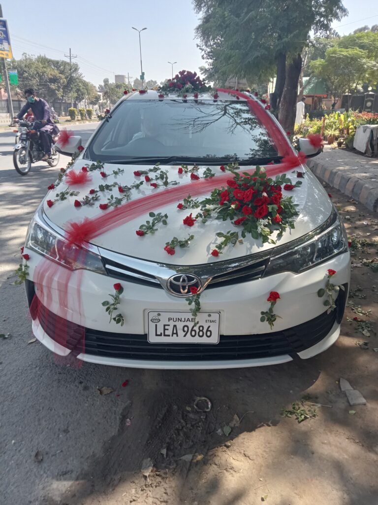 Premium wedding car decoration with orchids and roses