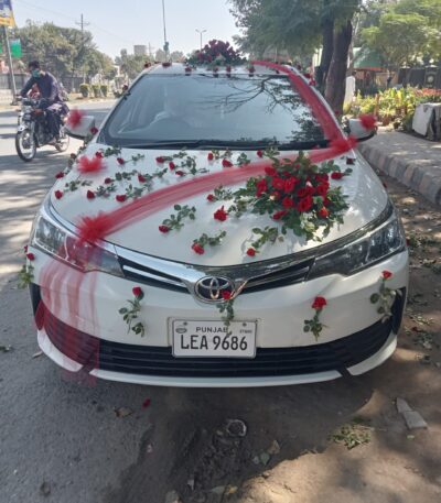 Premium wedding car decoration with orchids and roses