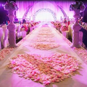 Elegant wedding stage décor with fresh red and white flowers in Sargodha